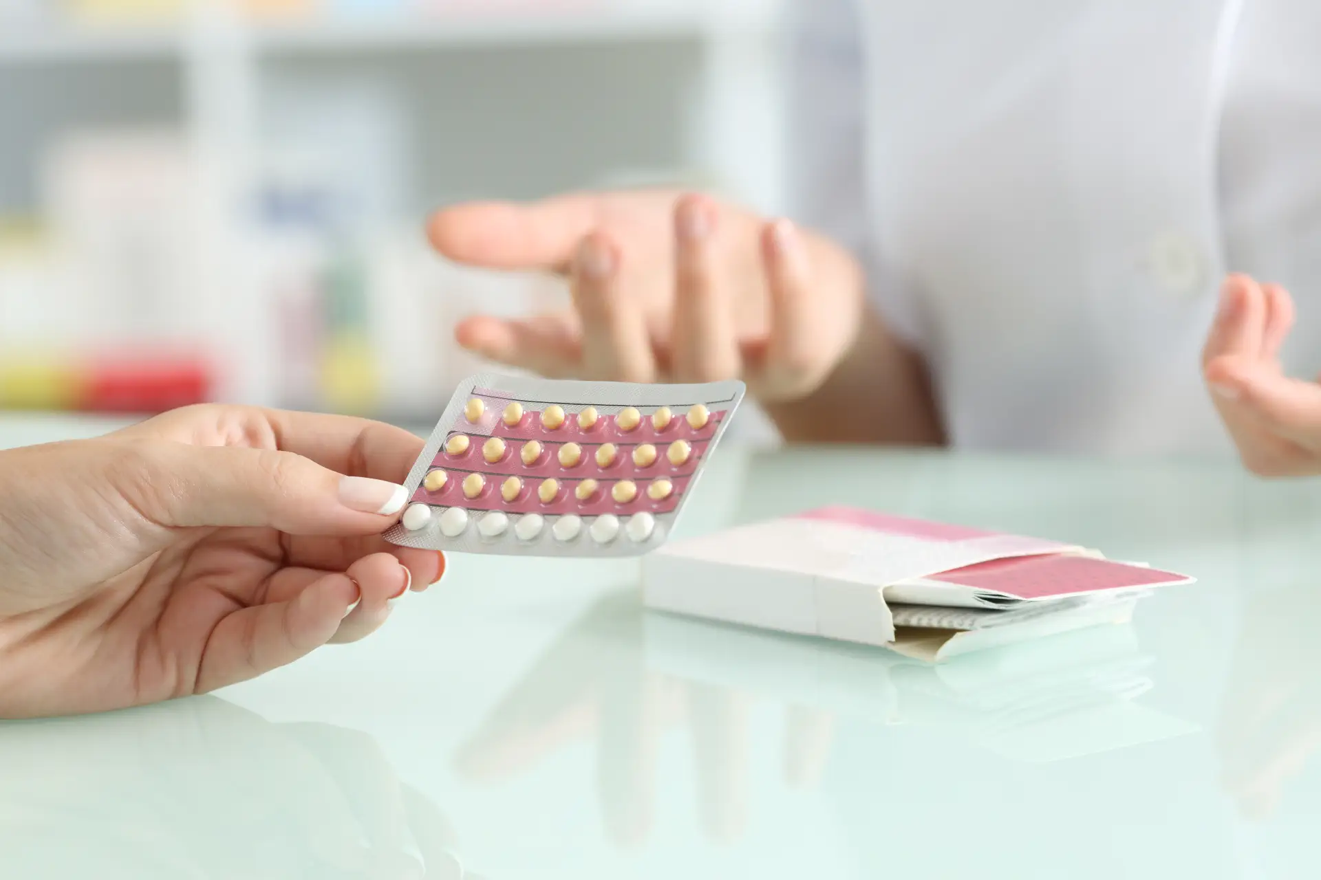 A woman discussing contraception options with a doctor.